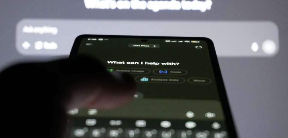 Typing a prompt to an AI assistant on a phone Typing a prompt to an AI assistant on a phone